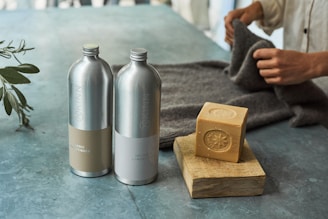 a couple of metal containers with metal objects on a table