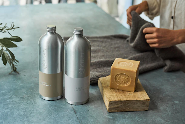 a couple of metal containers with metal objects on a table