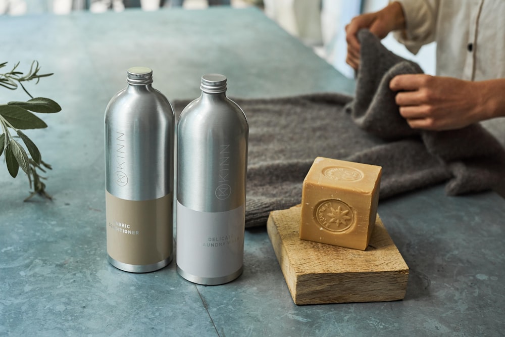 a couple of metal containers with metal objects on a table