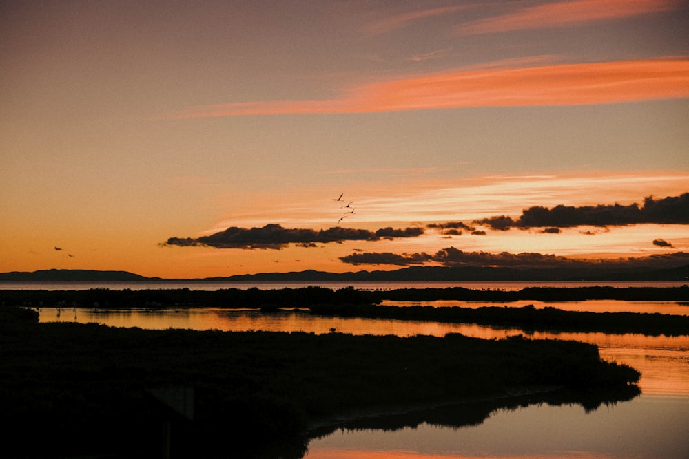 a sunset over a lake