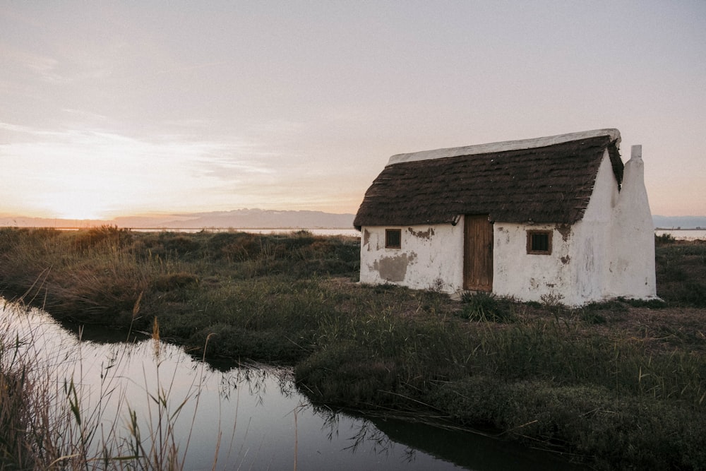 a white house in a marsh