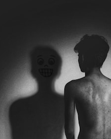 a boy looking at a skeleton
