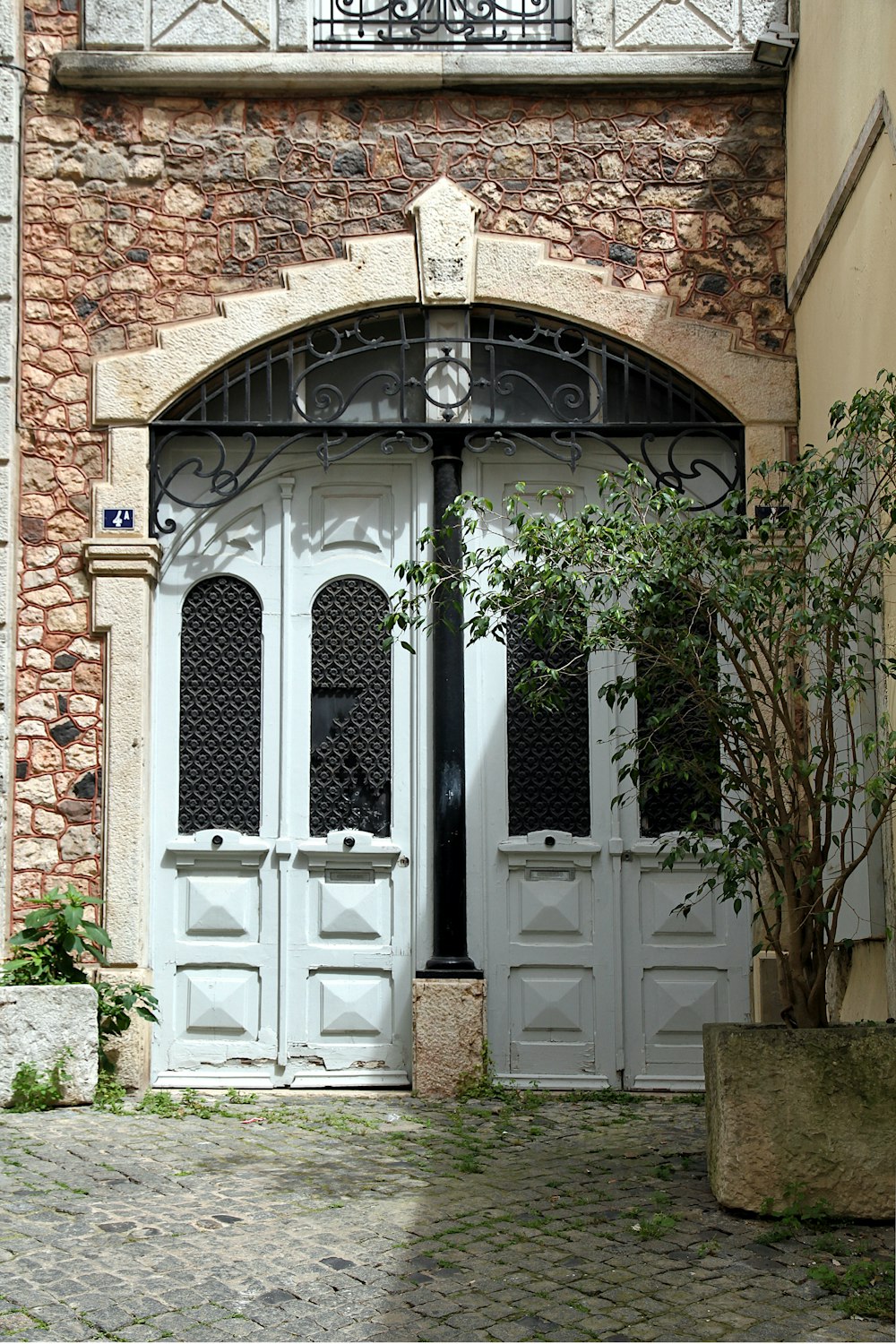 a building with a gate and a door with a window