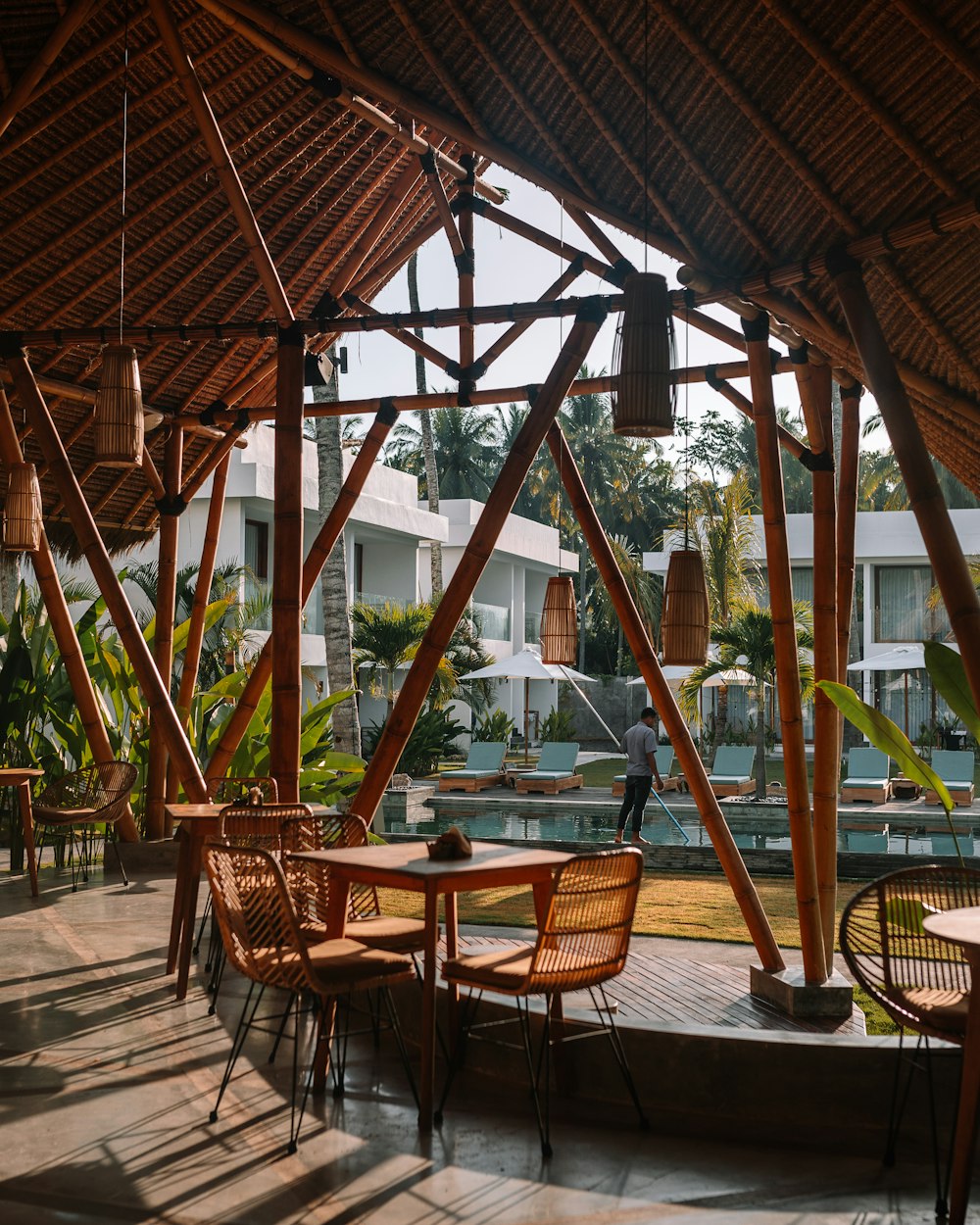 a patio with tables and chairs