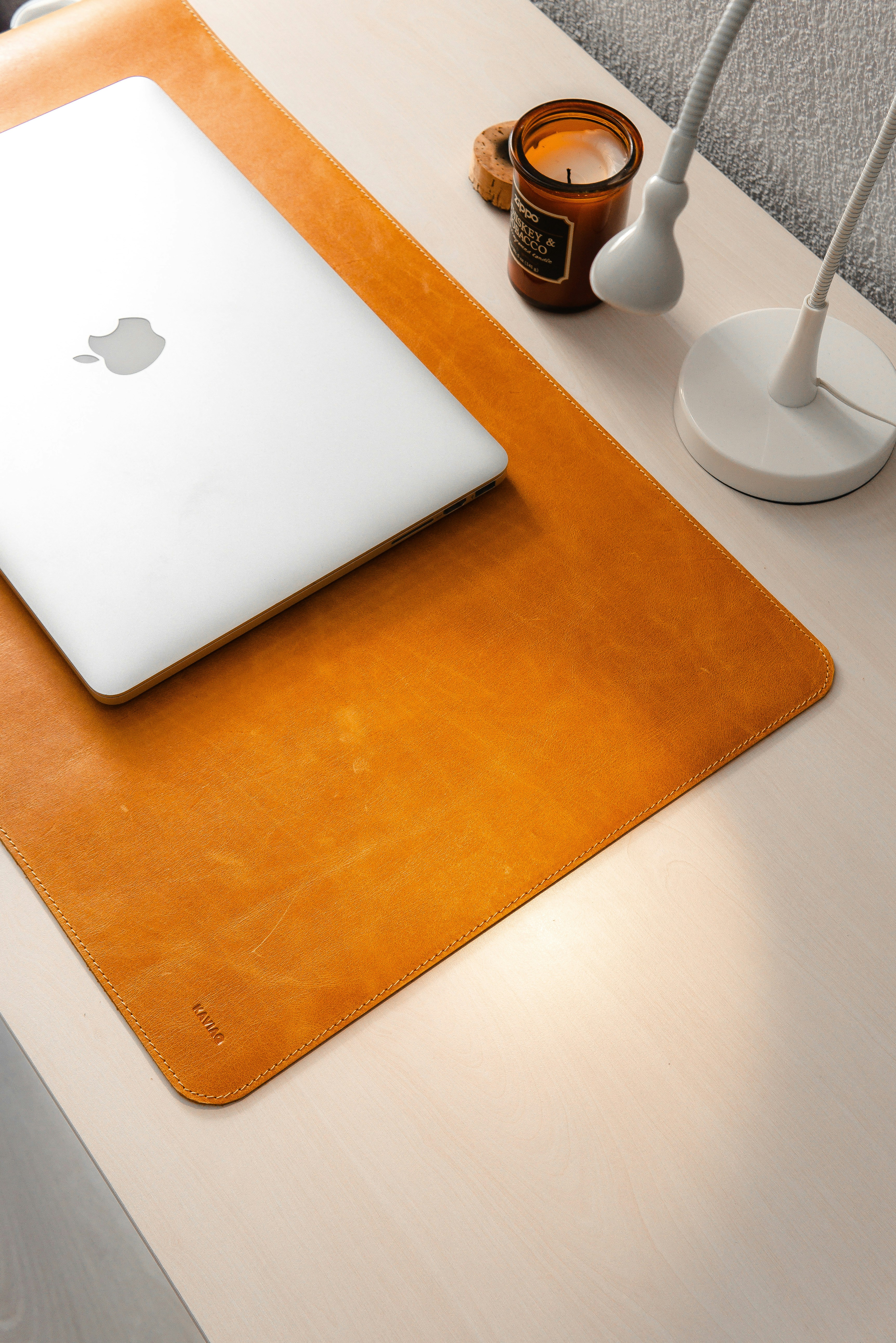 a laptop and a coffee cup on a table