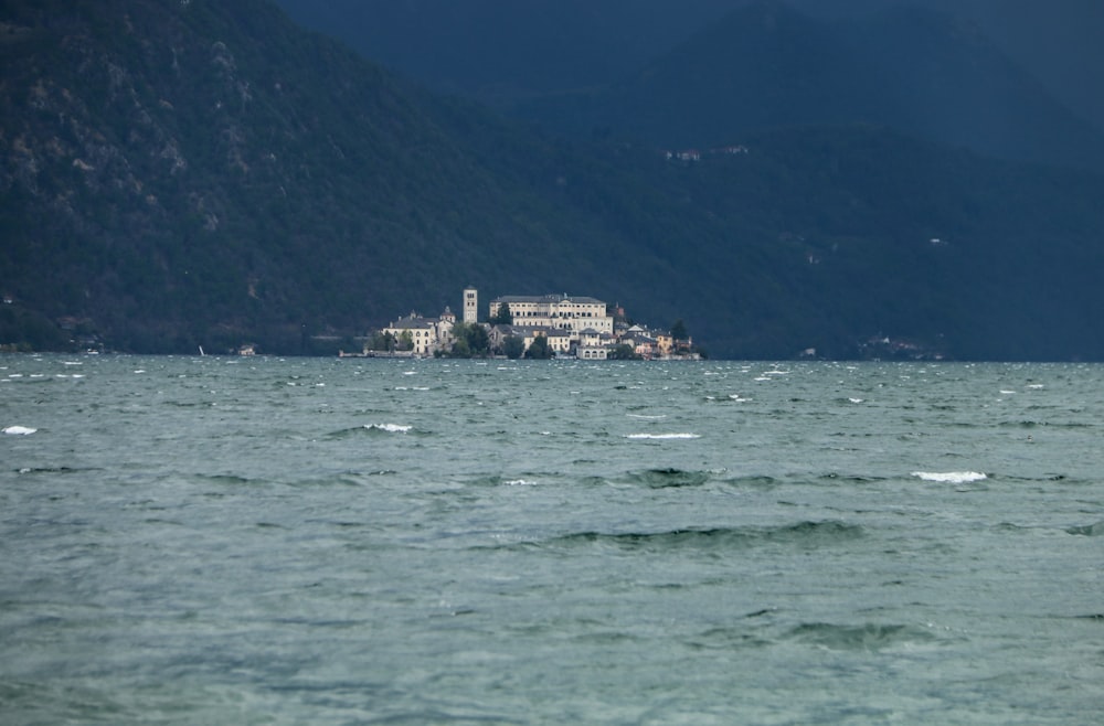 a body of water with a large building in the distance