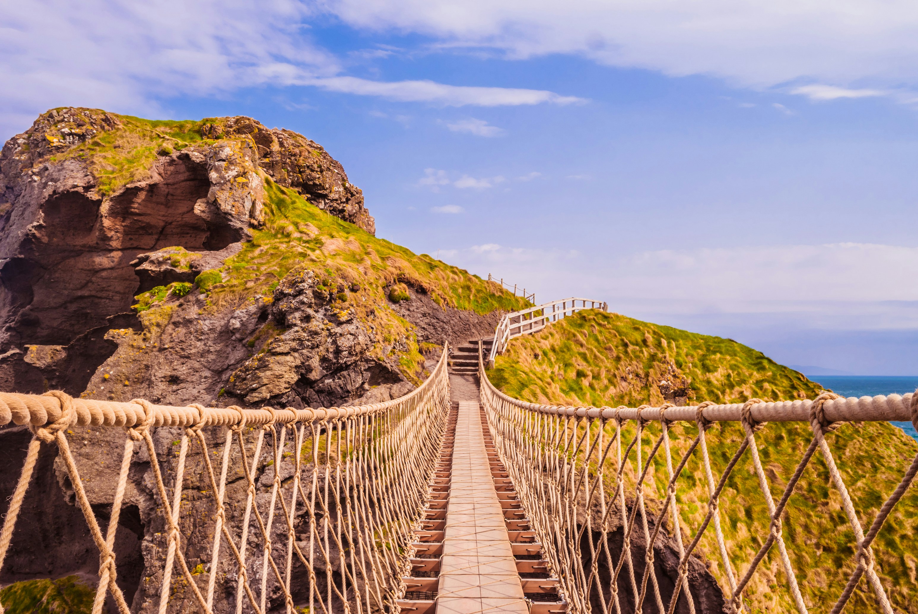 A long wooden bridge over a cliff photo – Free Building Image on Unsplash