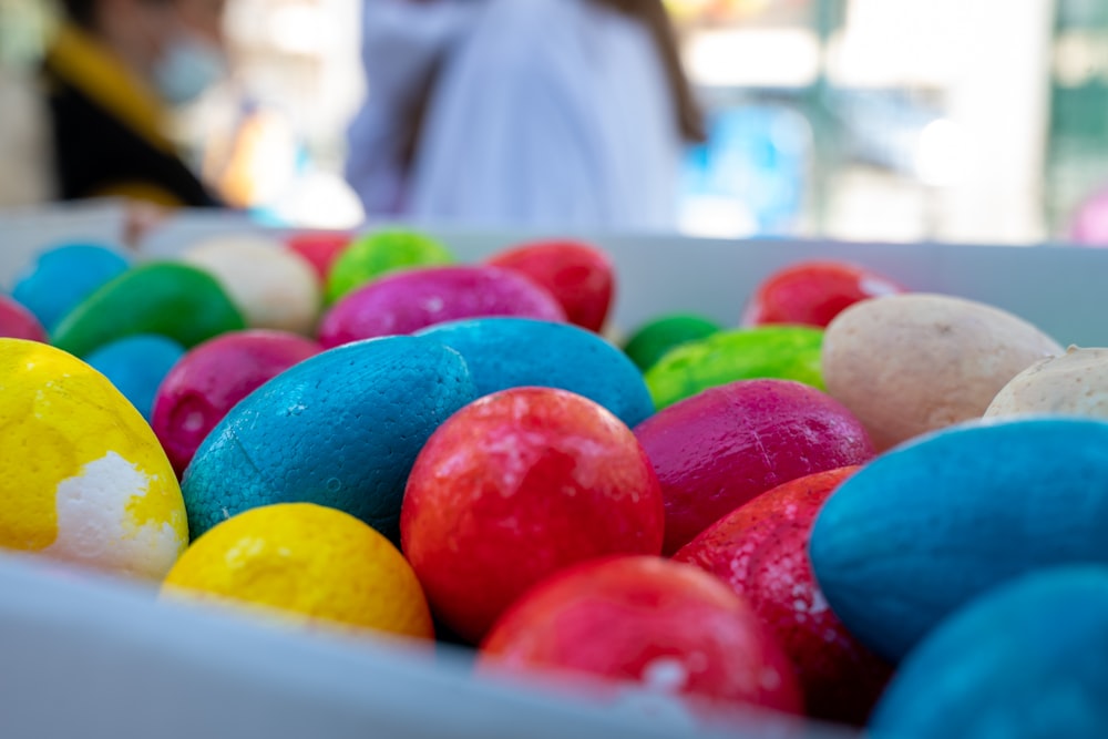 a bowl of colorful eggs