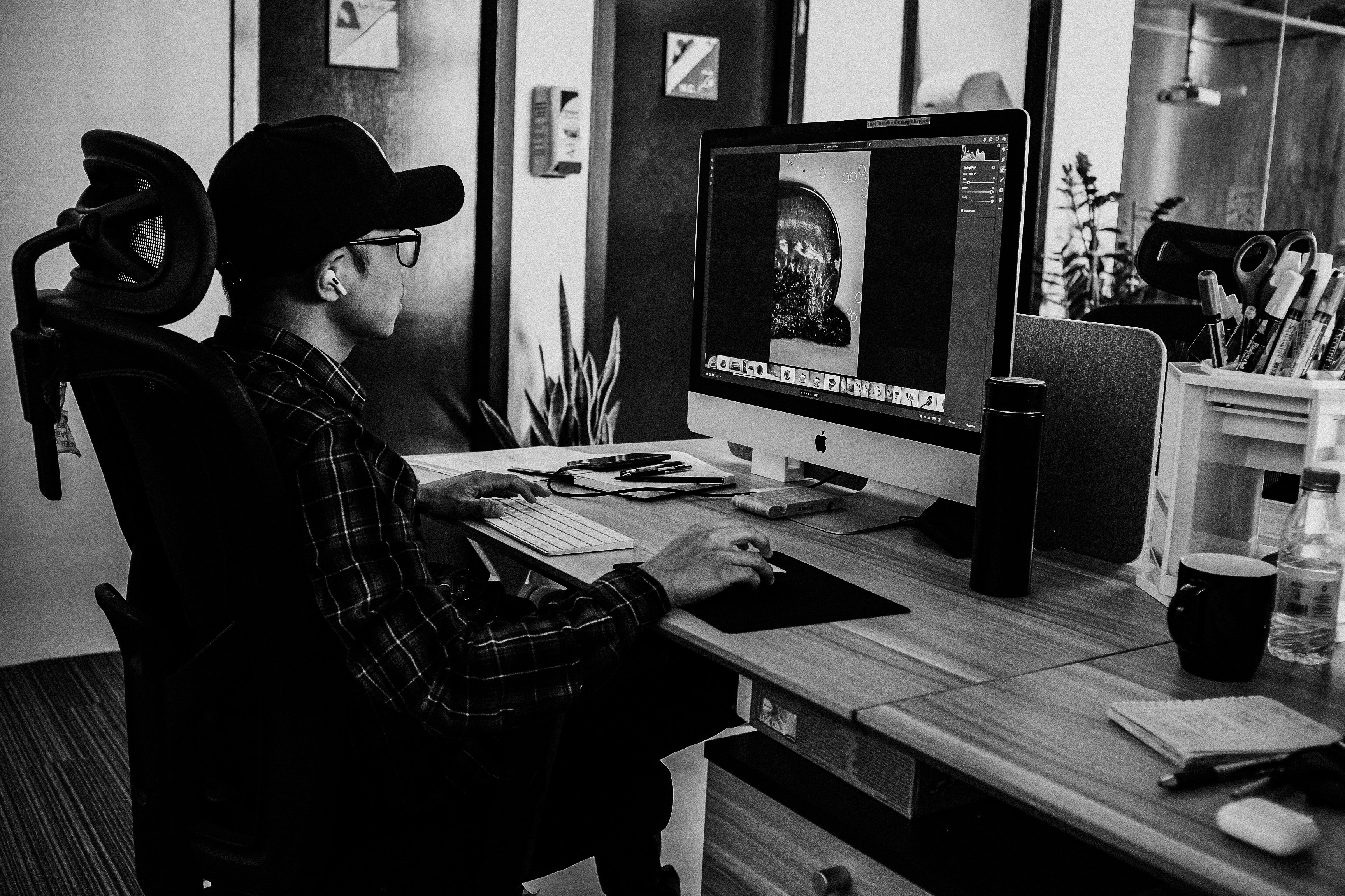 a person sitting at a desk with a computer