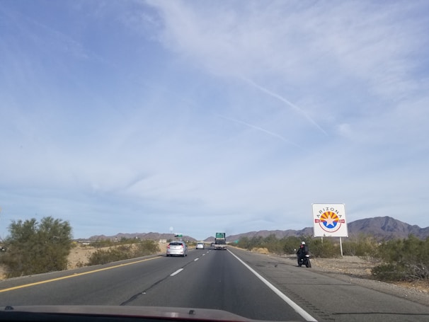 Wide shot of a large billboard sign installation on a highway near Scottsdale