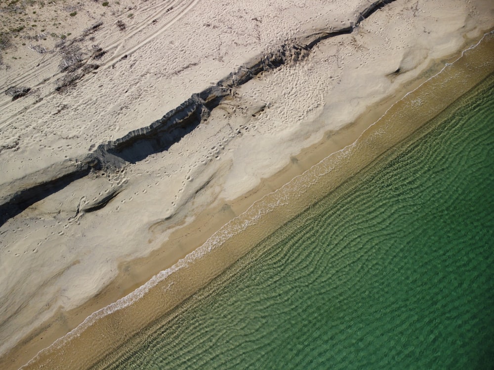 a beach with sand and water