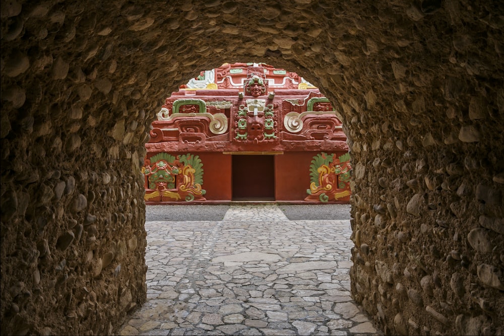 a stone walkway with a building in the background