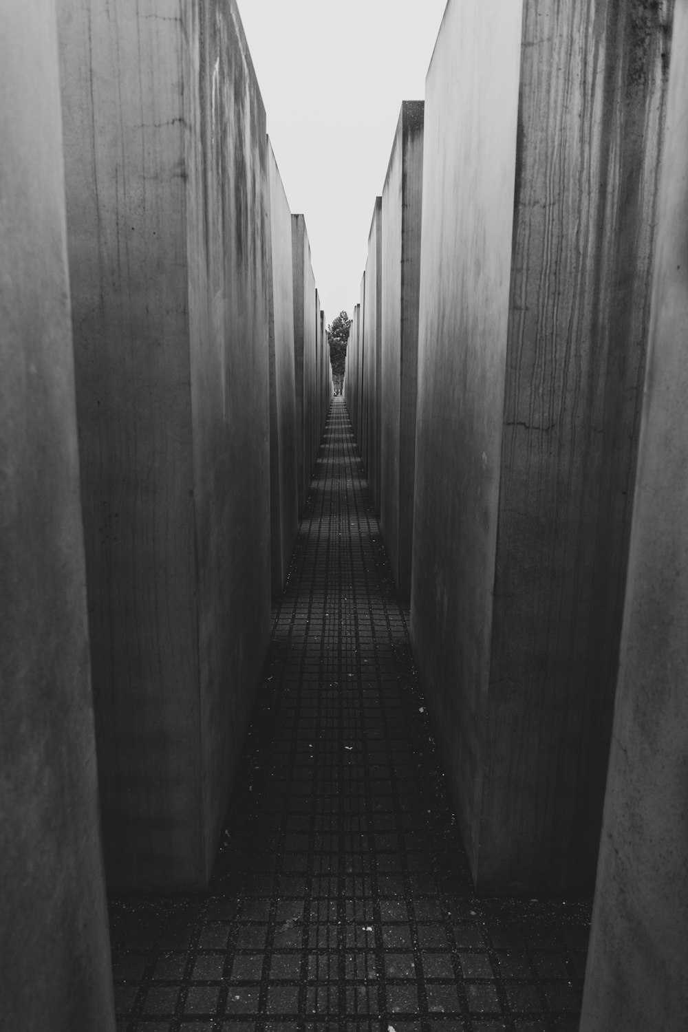 a person walking down a narrow hallway