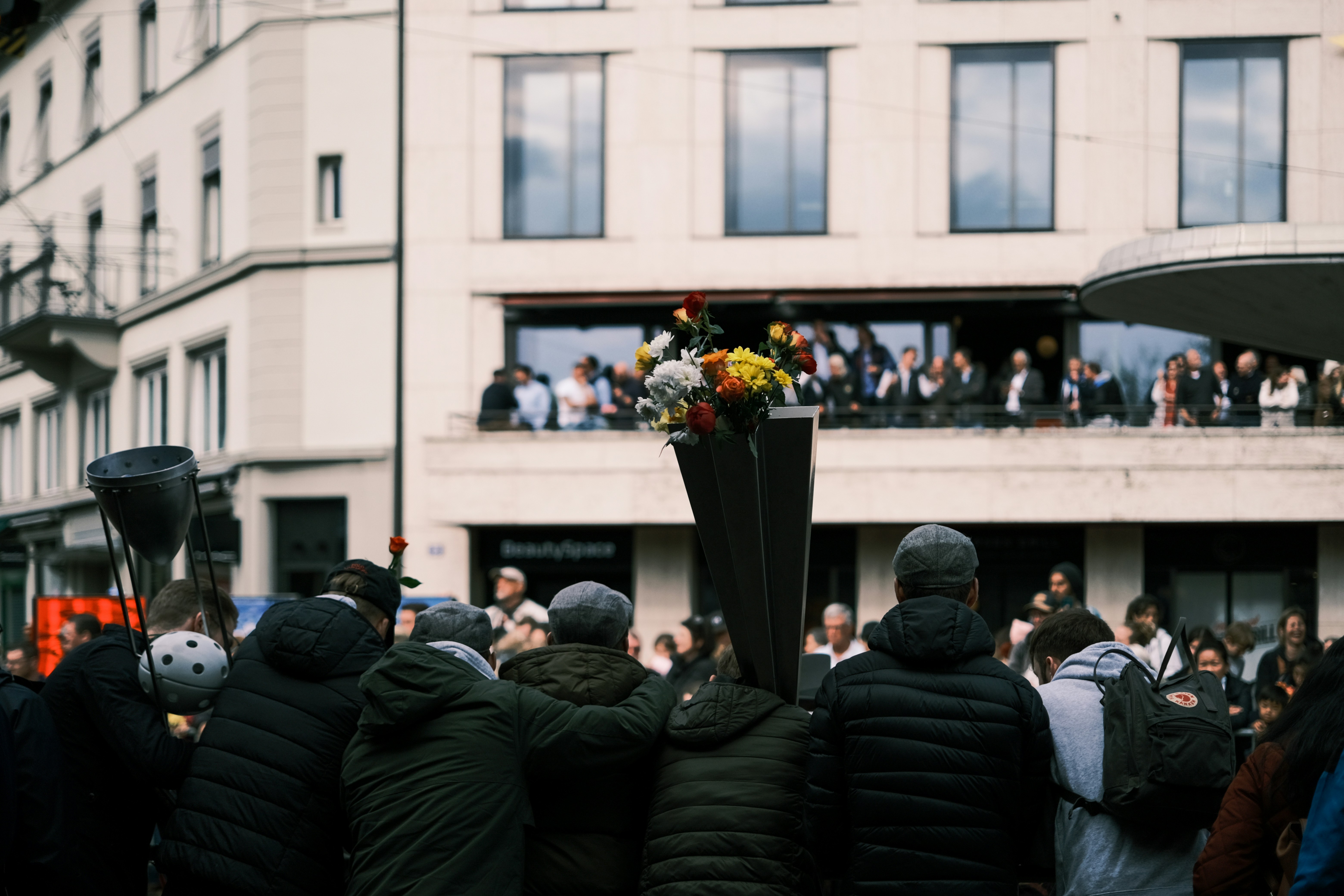 a group of people outside, 