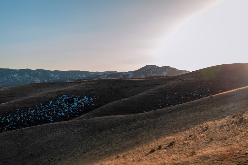 a large area of land with mountains in the background