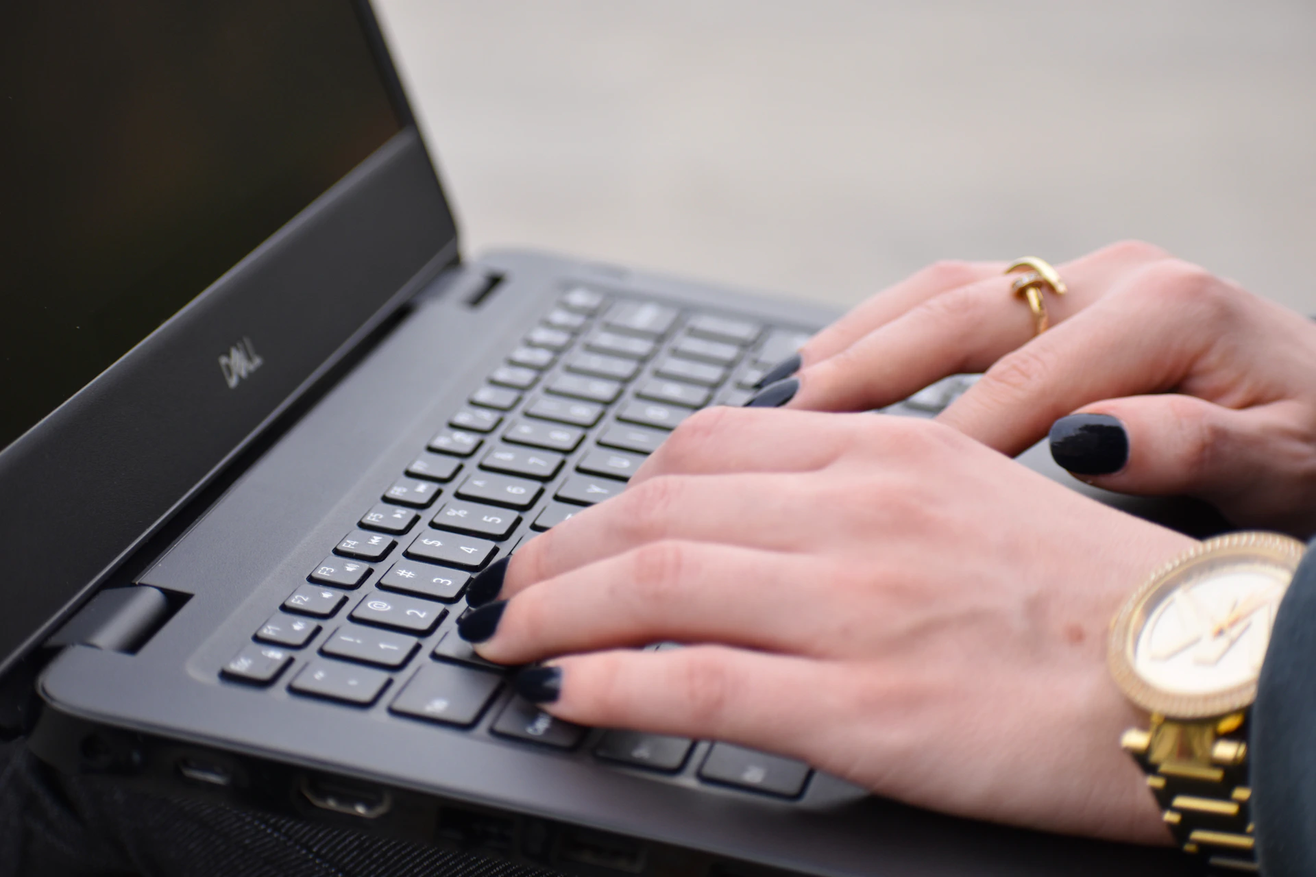 a person typing on a laptop