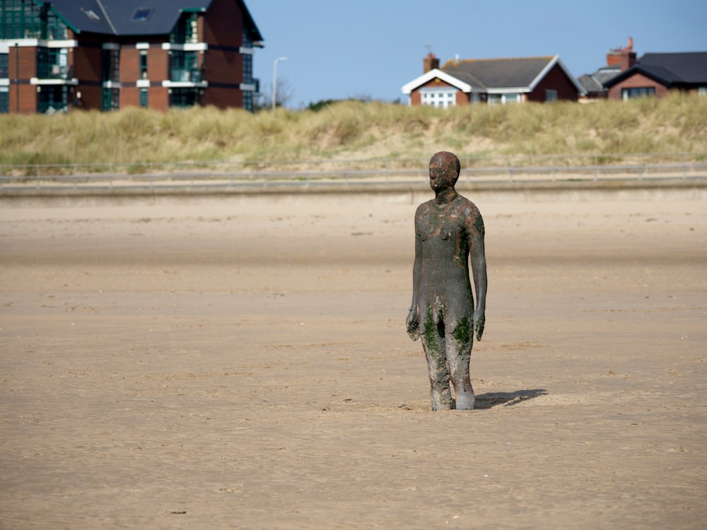 a statue of a man on a road