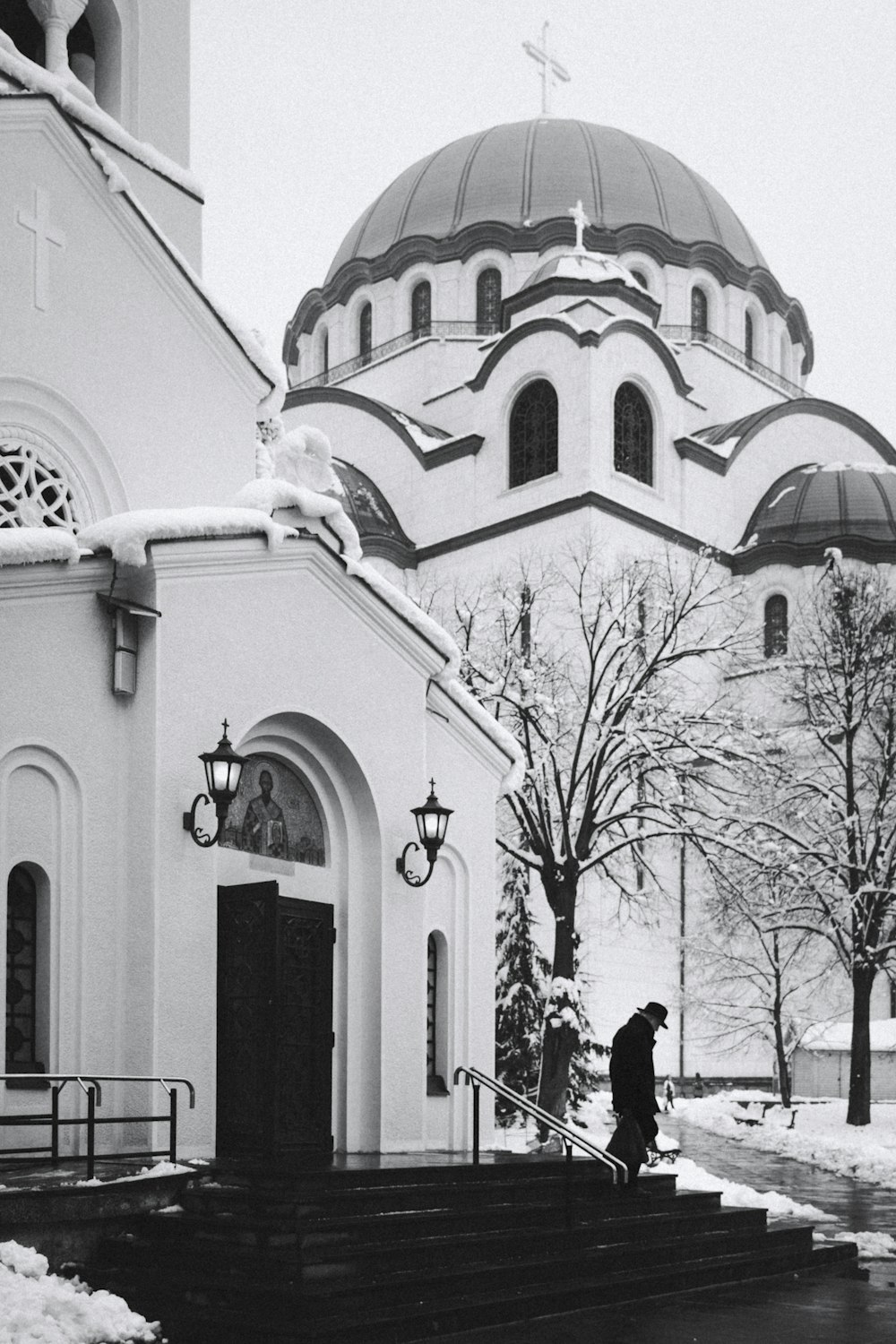 a person walking up stairs to a church