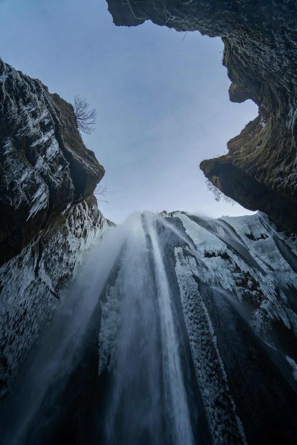 a waterfall between large rocks