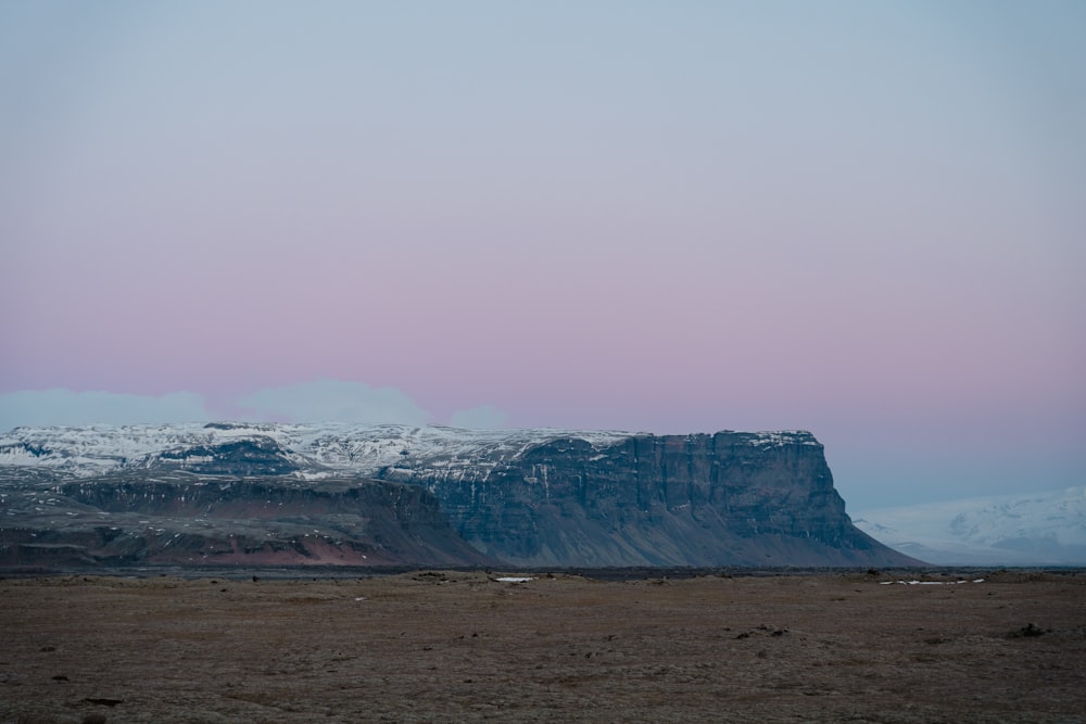 a large mountain with snow