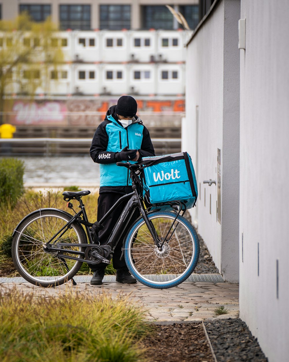 a person standing next to a bicycle