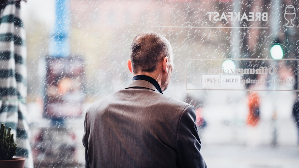 a man looking at a window