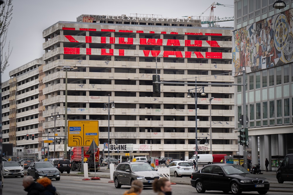 a large white building with red text