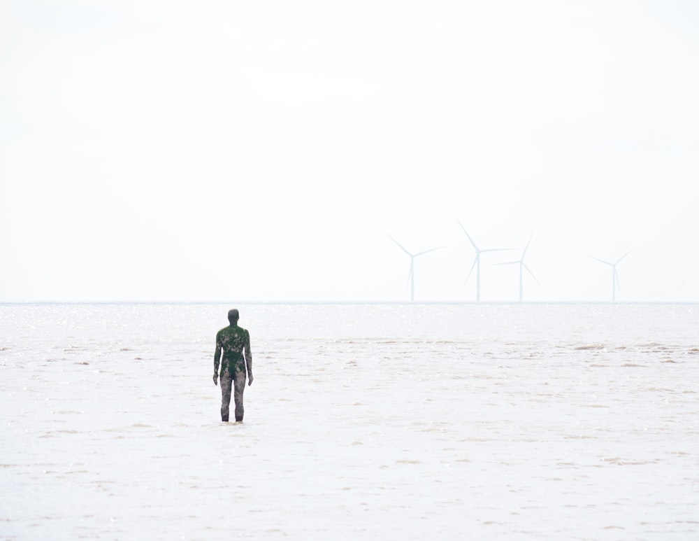 a man walking in a snowy field