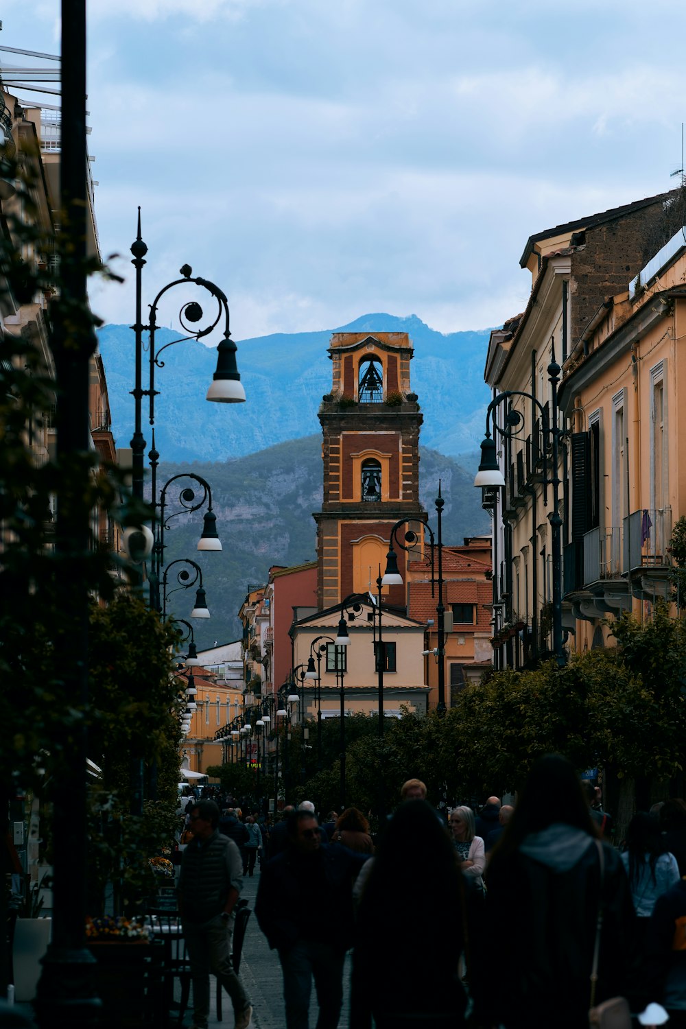 a group of people walking on a city street