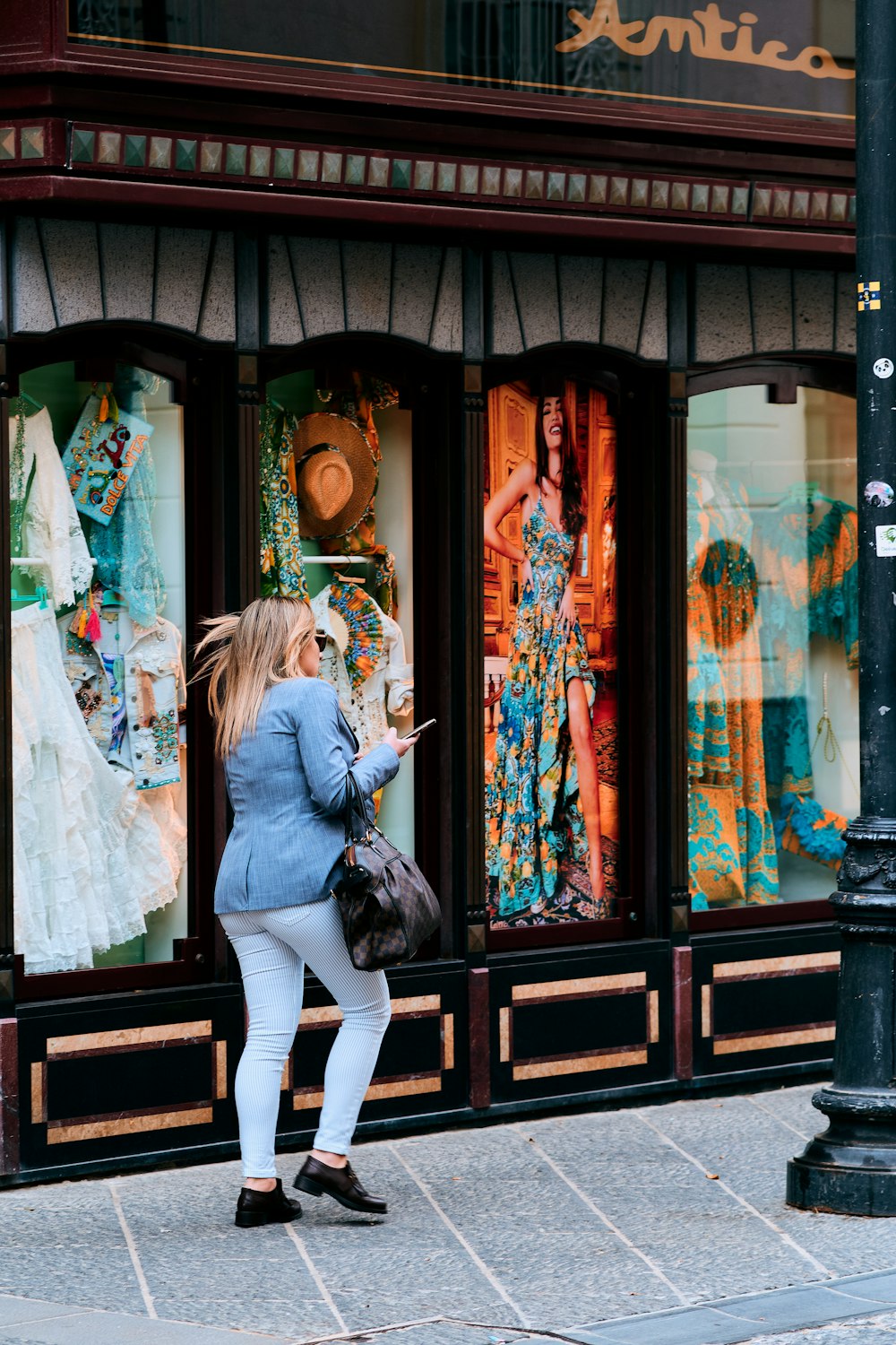 a person looking at a painting on a wall