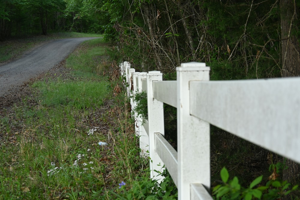a white fence with a white railing