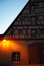Cozy Airbnb rental in a charming half-timbered house in Troyes at sunset.