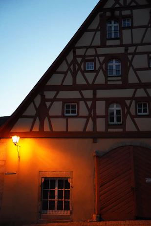 Cozy Airbnb rental in a charming half-timbered house in Troyes at sunset.