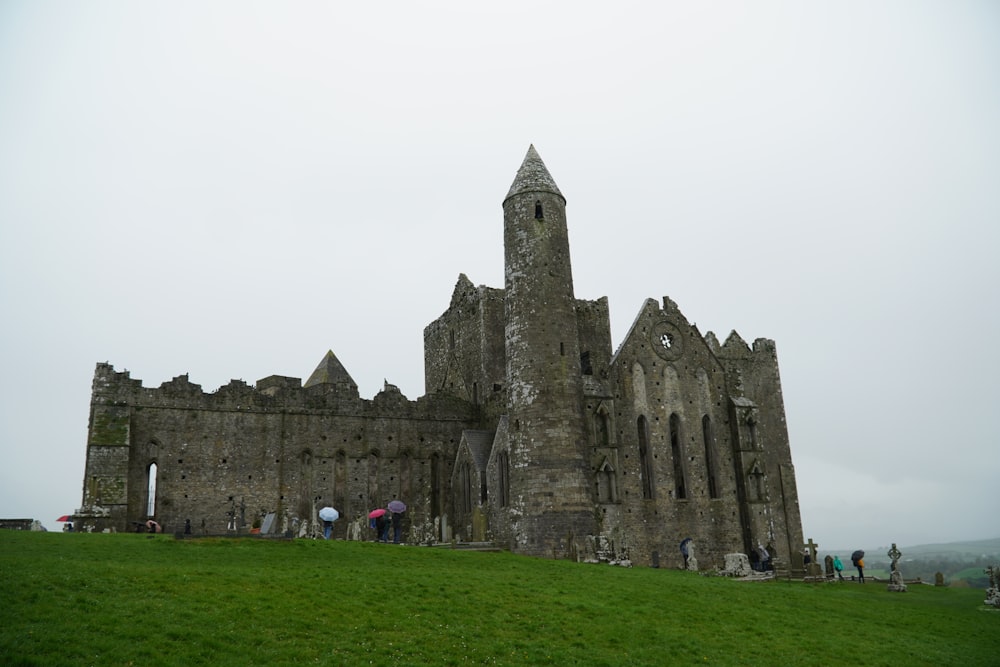 a castle with people standing in front of it