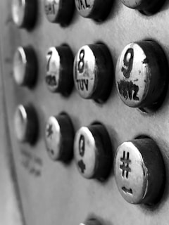 Historic black-and-white photo of early number-on devices, showcasing our origins.