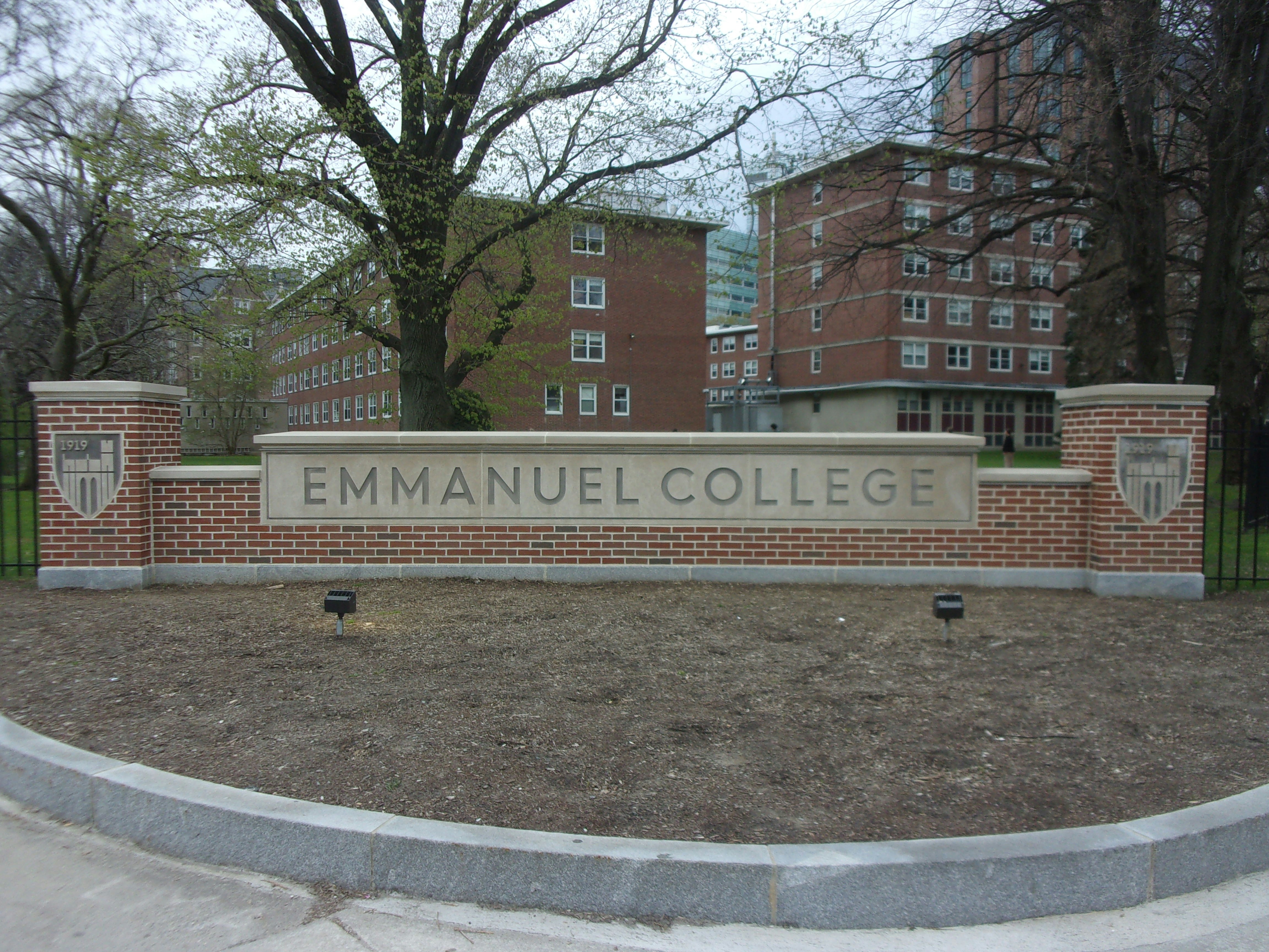 a sign on a brick wall