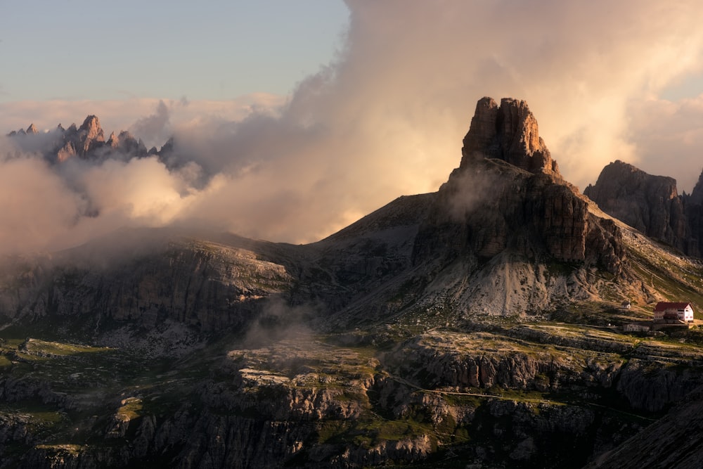 a rocky mountain with a valley below