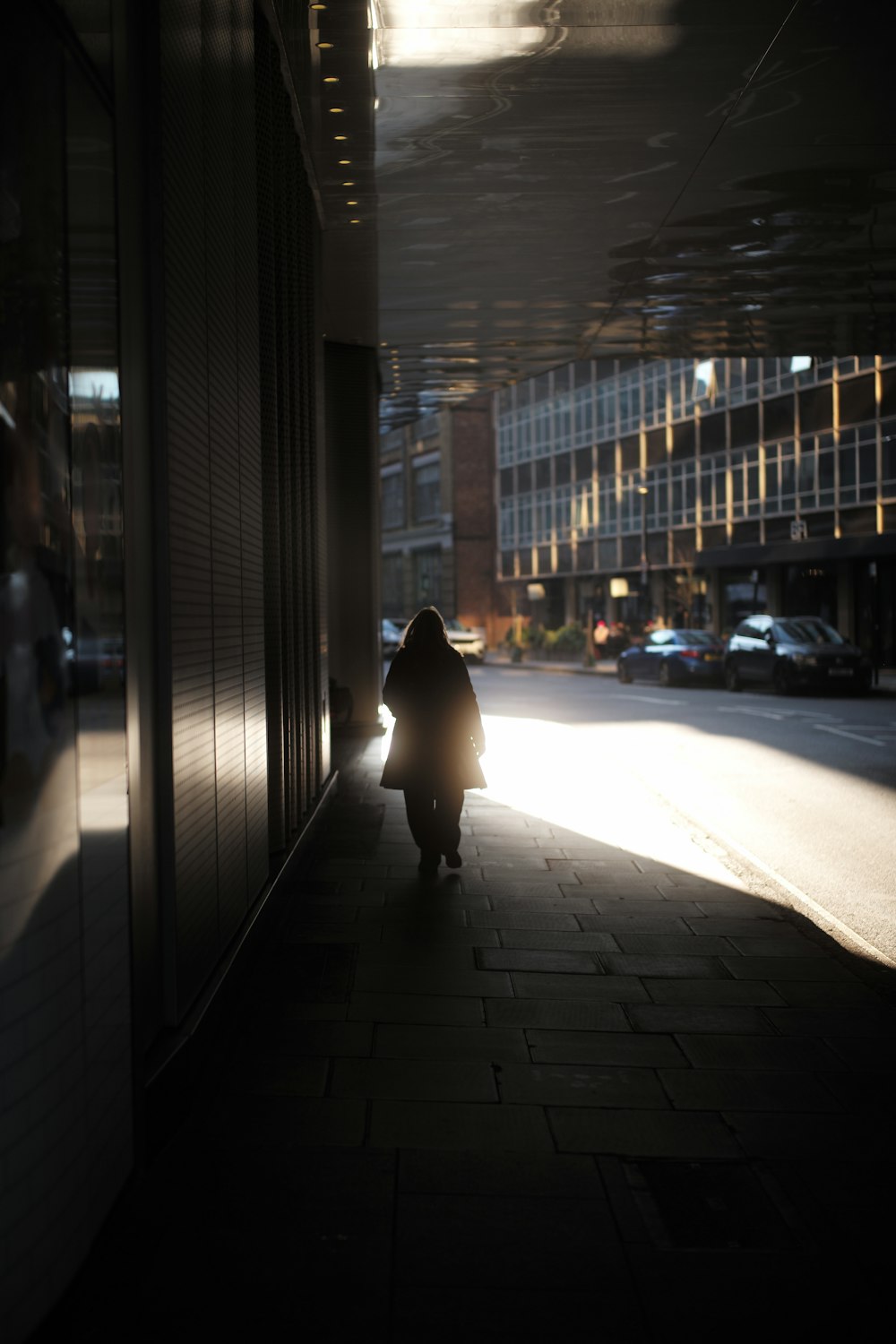 a person walking down a sidewalk