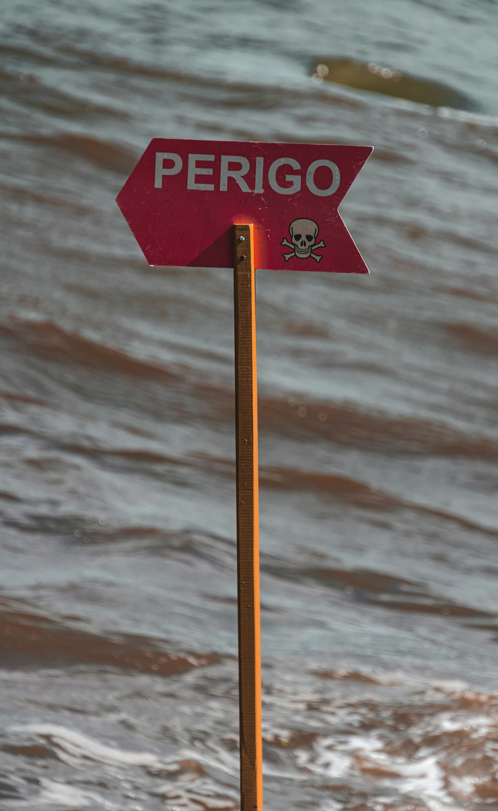 a red sign in the water