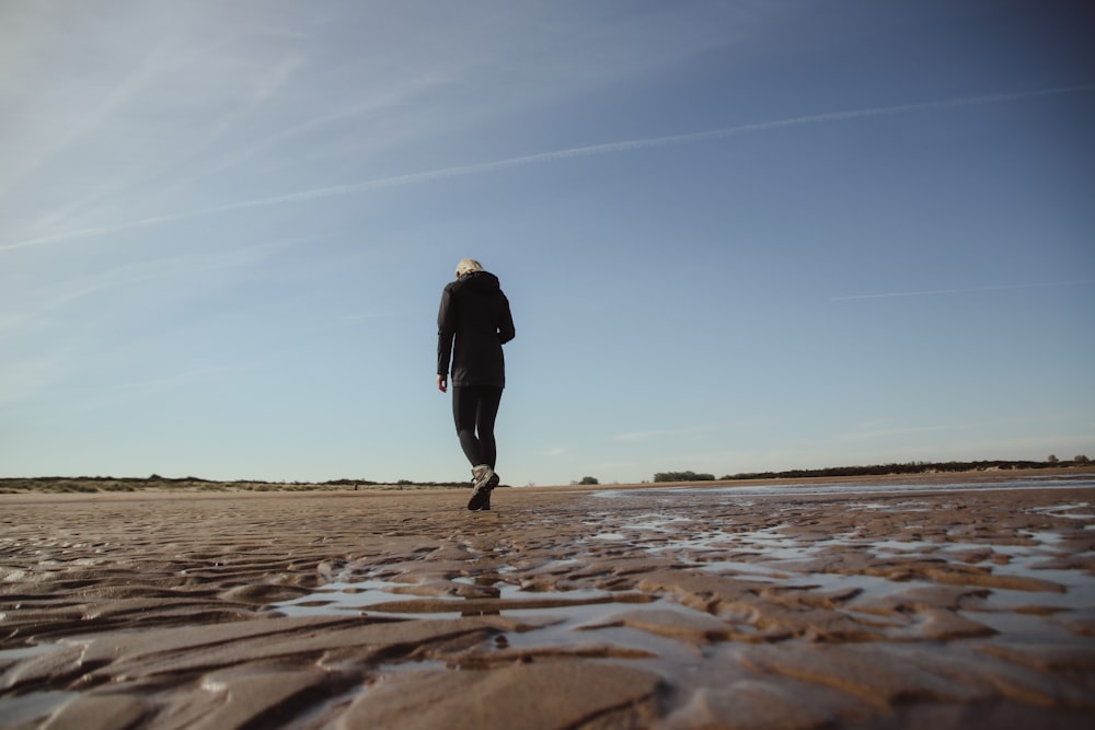 a person walking on a beach