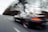 A dynamic shot of a custom-built car on an open road.
