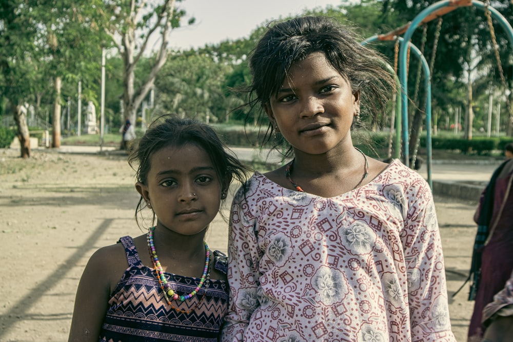 a couple of girls posing for the camera