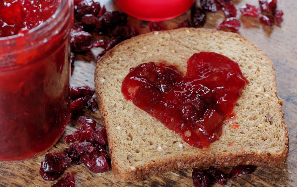 a piece of bread with jam and jam on it
