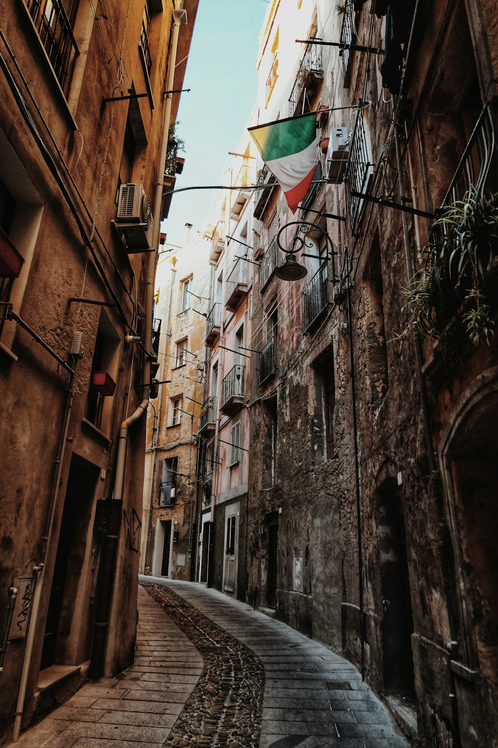 a narrow street with buildings on both sides