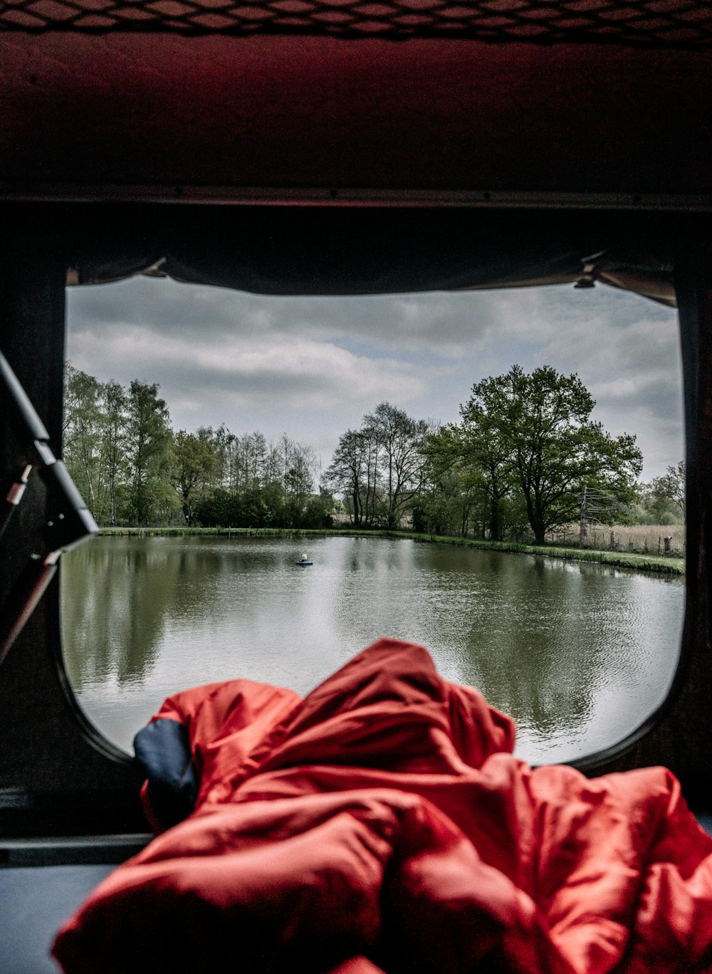 a red kayak on a river