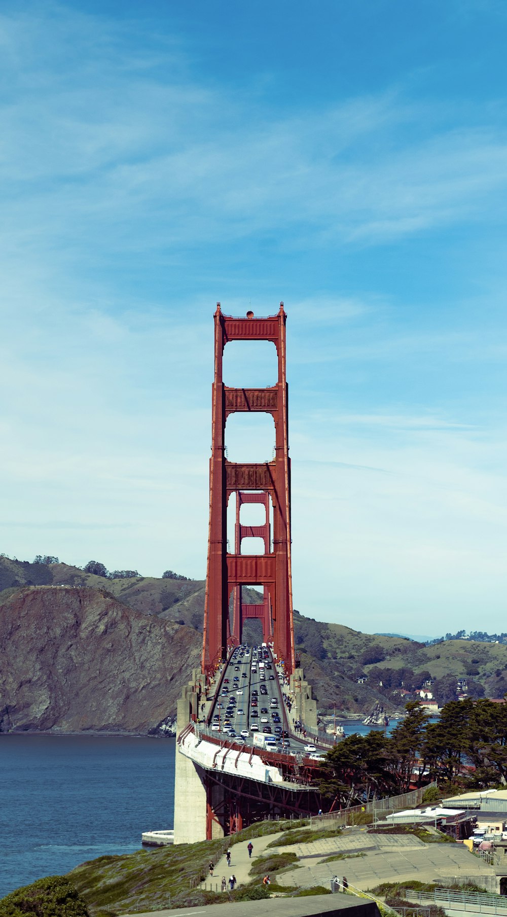 a large red bridge over water