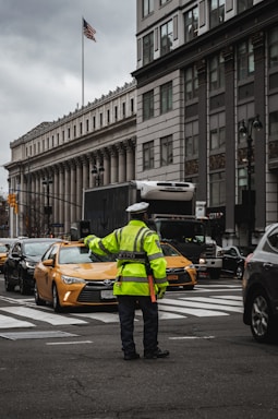 A friendly customer service representative assisting a driver with legal questions about traffic fines.