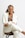 a woman in a white coat