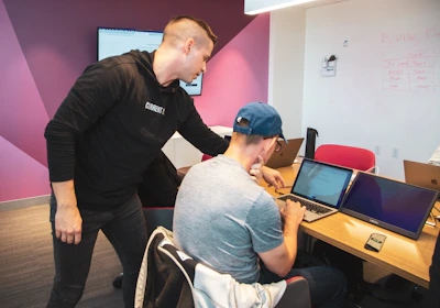 Team collaborating on a cross-platform app development project in a modern office.