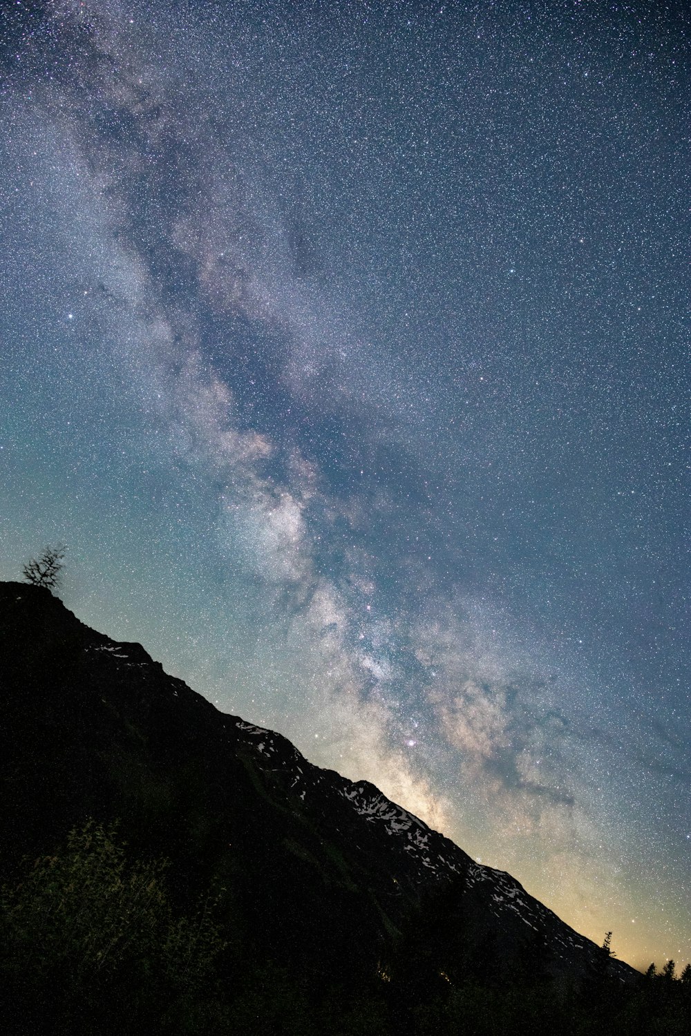 a mountain with a starry sky above it